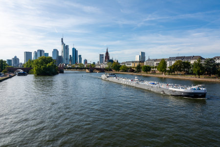 FRANKFURT, GERMANY - SEPTEMBER 15: Barge on the Main river in Frankfurt , Germany on September 15, 2019. Foto taken from Ignatz-Bubis Bridge with view to skyline of Frankfurt.のeditorial素材