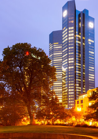 FRANKFURT, GERMANY - SEPTEMBER 16: Night scene with Deutsche Bank Headquarters in Frankfurt, Germany on September 16, 2019. Deutsche Bank is the largest bank in Germany. Foto taken from Taunus park.のeditorial素材