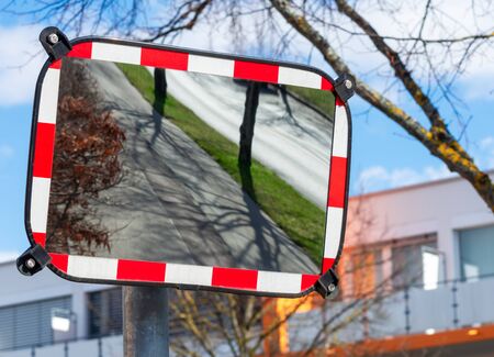 Empty road reflected in a traffic mirrorの写真素材