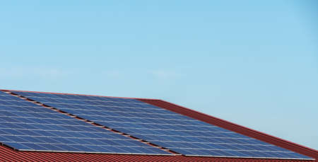Alternative energy with solar cells on the roofの写真素材