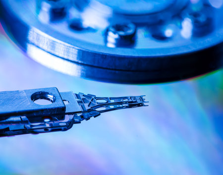 Macro of an open computer hard drive with the read/write head