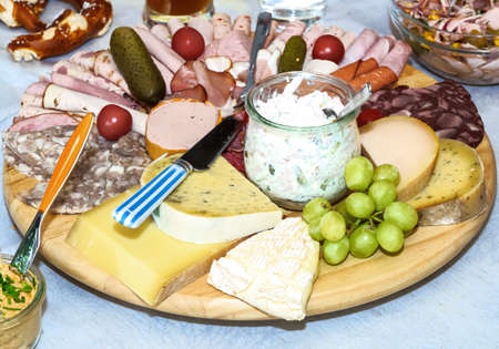 Decorated food for a birthday party with cheese and sausageの写真素材