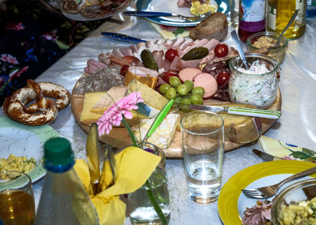Decorated table setting for a birthday party with lots of food