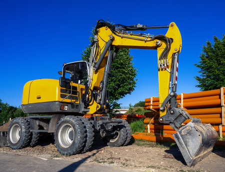 Construction site with a yellow excavator