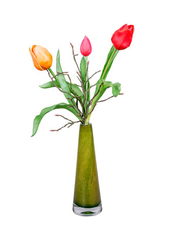 Spring deco with artificail tulips  isolated on white in a vaseの写真素材