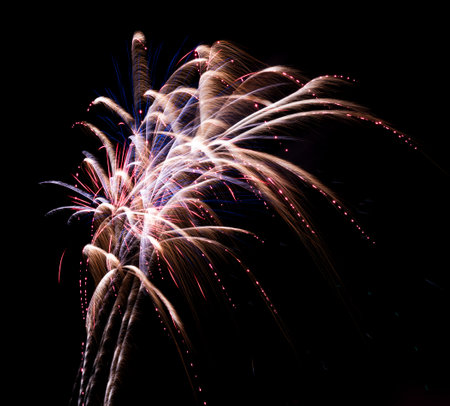Abstract fireworks background on the night skyの写真素材