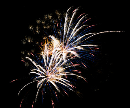 Abstract fireworks background on the night skyの写真素材