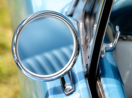 Vintage outside rear mirror of an old-timer.の写真素材