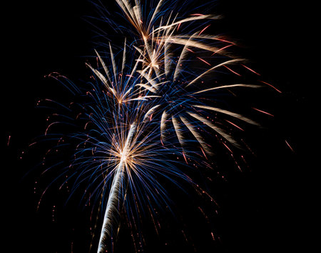 Abstract fireworks background on the night skyの写真素材