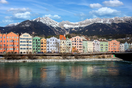 Riverside of Innsbruck at the Inn river with view to the alpsの写真素材