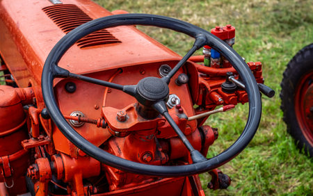 Steering wheel of an red old timer tractor