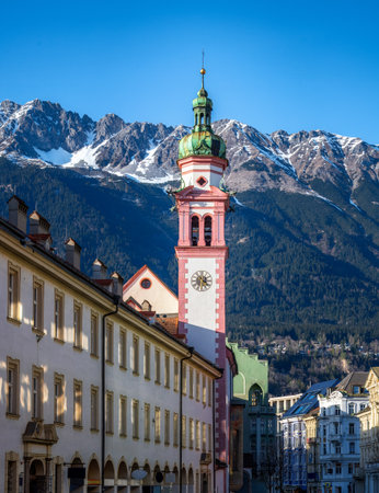 Servitenkirche church in Innsbruck with the alps in the backgroundの写真素材