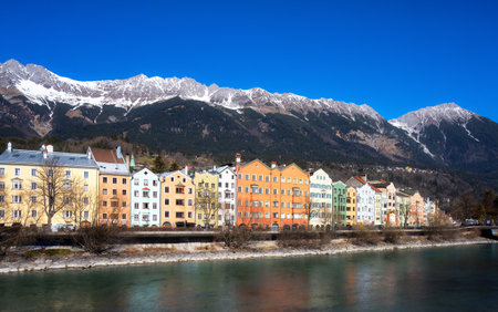 Riverside of Innsbruck at the Inn river with view to the alpsの写真素材
