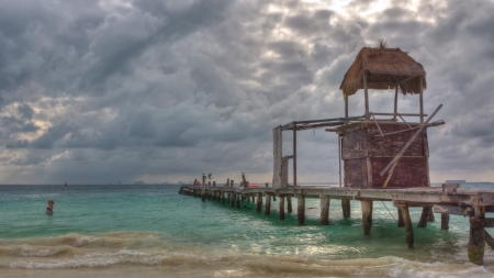 boat bridge and a watch tower on Cancun beachの写真素材