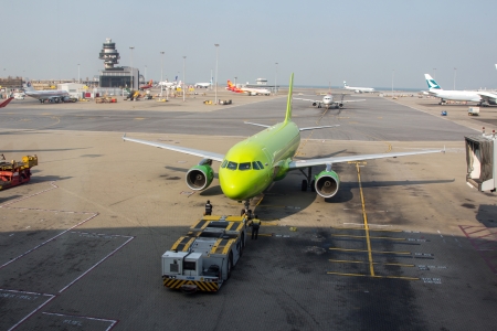 HONG KONG, CHINA - DEC 29, 2013  Preparing S7 Airlines airplane for flight in Hong Kong International Airport  About 90 airlines operate flights from HKIA to over 150 cities across the globe のeditorial素材