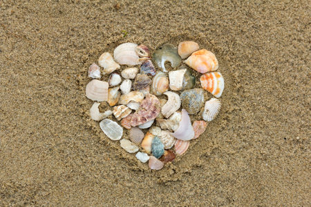 Heart shape on sandy beach