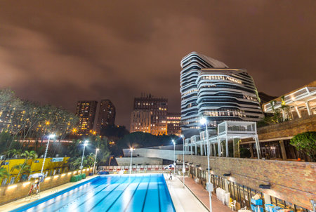 Night view of the Jockey Club Innovation Tower is home to Hong Kong Polytechnic University s School of Design  Designed by Pritzker-prize-winning architect Zaha Hadid のeditorial素材