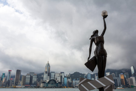 Statue and skyline in Avenue of Stars in Hong Kong, China  The promenade honors celebrities of the Hong Kong film industry as the famous city attraction  のeditorial素材