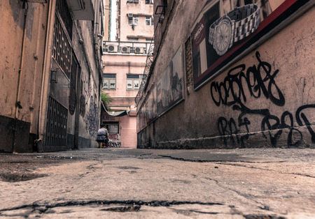 A Back alley in Wanchai in Hong Kong  Many old people in Hong Kong are poor and very often live alone in old buildings with inadequate living conditions  のeditorial素材