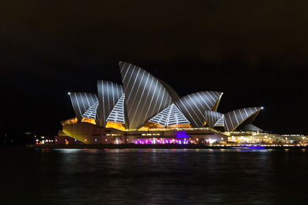 Sydney Opera House lit with vibrant colors patterns and moving imagery during the annual Vivid Sydney festival  のeditorial素材
