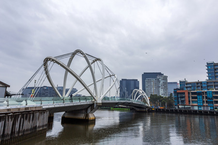 MELBOURNE, AUSTRALIA- JUNE 3, 2014  Seafarers Bridge over Yarra River in South Warf is the newest Yarra bridge in Melbourne for pedestrians and cyclistsのeditorial素材