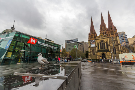 Melbourne visitor center and St  Paul s Cathedral next to Federation Square, in Melbourne のeditorial素材