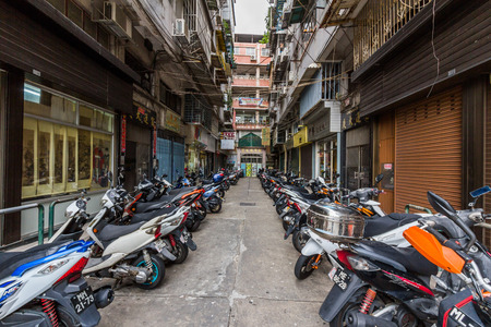 Motor scooters parked in Macau, China  Scooters, being the primary mode of transport for locals, are a wonderful way to see the sites of Macau  のeditorial素材