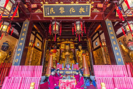 A statue in the Temple of the Town Gods (Chenghuang Miao) in Shanghai, China. It dates from 1403 though the current building site is new, constructed in the 1990s.のeditorial素材
