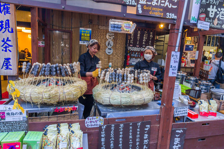 A dango shop at Mt. Takao in Tokyo. Dango is eaten year-round, but the different varieties are traditionally eaten in given seasons.のeditorial素材