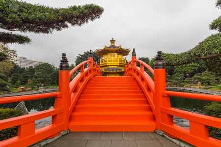 The Golden Pavilion of Perfection in Nan Lian Garden, Hong Kong. It is designed in the Tang Dynasty-style with hills, water features, trees, rocks and wooden structures.のeditorial素材