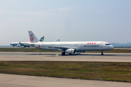 Dragonair flight in Hong Kong International Airport. About 90 airlines operate flights from HKIA to over 150 cities across the globe.のeditorial素材