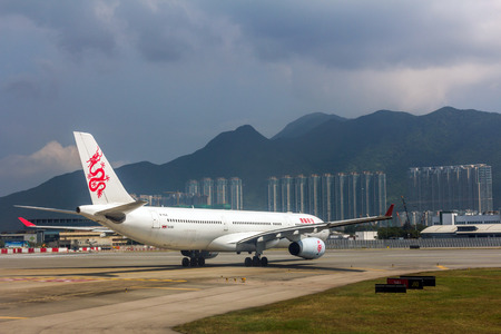 Dragonair flight in Hong Kong International Airport. About 90 airlines operate flights from HKIA to over 150 cities across the globe.のeditorial素材