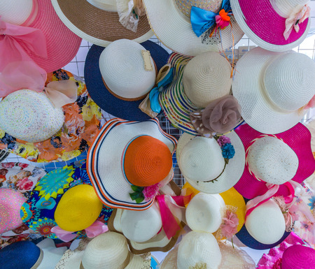 Many hats hanging on a wallの写真素材