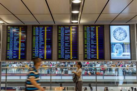 Electronic display in Hong Kong International Airport shows gate change of flight to Shanghai. About 90 airlines operate flights from HKIA to over 150 cities across globe.のeditorial素材
