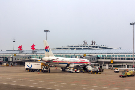 China Eastern Airlines flight in Guilin Liangjiang International Airport. In 2014 it was the 33rd busiest airport in China with 5875327 people.のeditorial素材