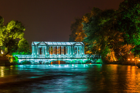 A colorful glass bridge over the banyan lake in night in Guilin Chinaの写真素材