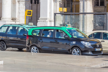 Taxis operating in Lisbon are required to have working meters and fares posted to the window in the rear seat.のeditorial素材