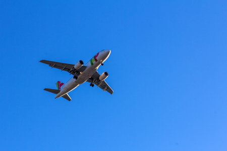 TAP Portugal flight flying over Lisbon sky. It is the flag carrier airline of Portugal headquartered...