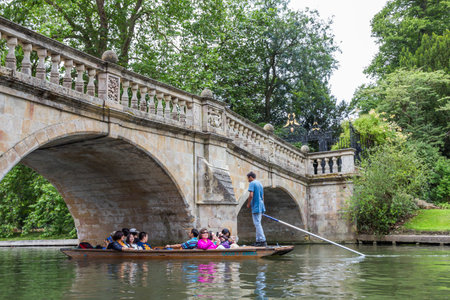 Punting in summer on the river Cam. There are several companies on the Cam operating tours and...