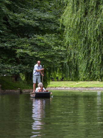 Punting in summer on the river Cam. There are several companies on the Cam operating tours and hiring punts to visitors.のeditorial素材