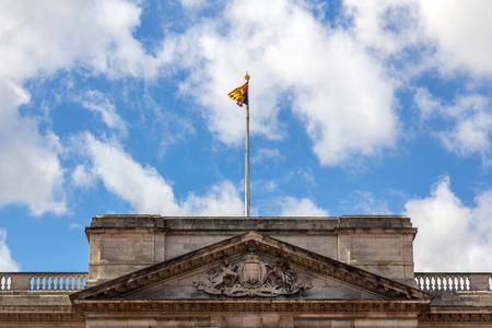 Royal Standard of the United Kingdom waving on the Buckingham Palace in Londonのeditorial素材