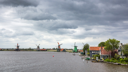 Windmills and rural houses in Zaanse Schans near Amsterdam, Netherlandsの写真素材
