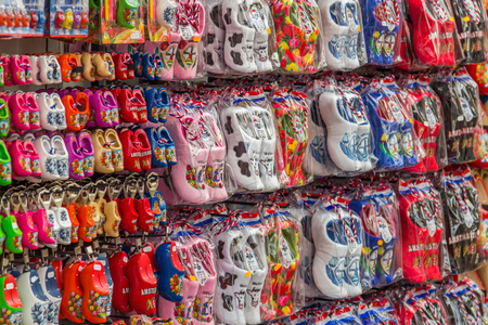 Clogs for sale at a Dutch retail shop. Wooden shoes are a well know traditional souvenir from Hollandのeditorial素材