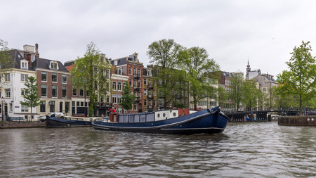 Canals through the residential areas of Amsterdam. Amsterdam is the capital and most populous city of the Netherlands.のeditorial素材