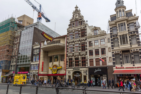 Shops at the Damrak. It is an avenue and partially filled in canal at the centre of Amsterdam, running between Amsterdam Centraal and Dam Square.のeditorial素材