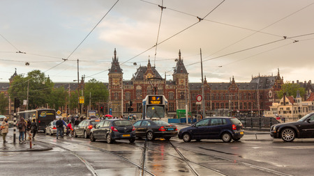 A traffic jam in front of Amsterdam Centraal station. The Amsterdam region is one of the busiest regions of the Netherlands.のeditorial素材