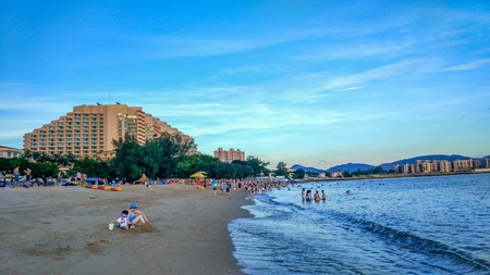 People enjoying a sunny day at Golden beach in Tuen Mun.のeditorial素材