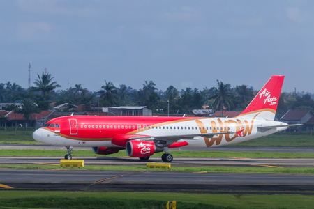 AirAsia plane on a runway of Soekarno-Hatta International Airport in Jakarta, Indonesia.のeditorial素材