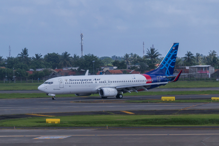 Sriwijaya Air plane on a runway of Soekarno-Hatta International Airport in Jakarta, Indonesia.のeditorial素材