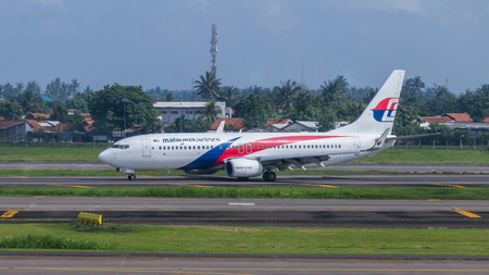 Malaysia Airlines plane on a runway of Soekarno-Hatta International Airport in Jakarta, Indonesia.のeditorial素材